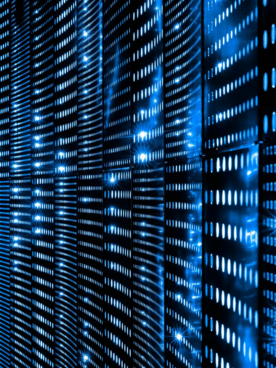 Rows of server indicator lights glowing blue